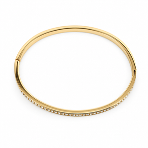 Gold bangle with small stones on a white background