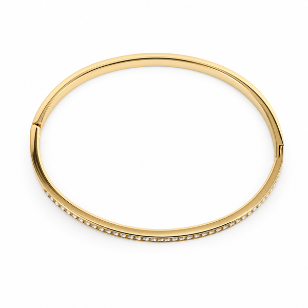 Gold bangle with small stones on a white background